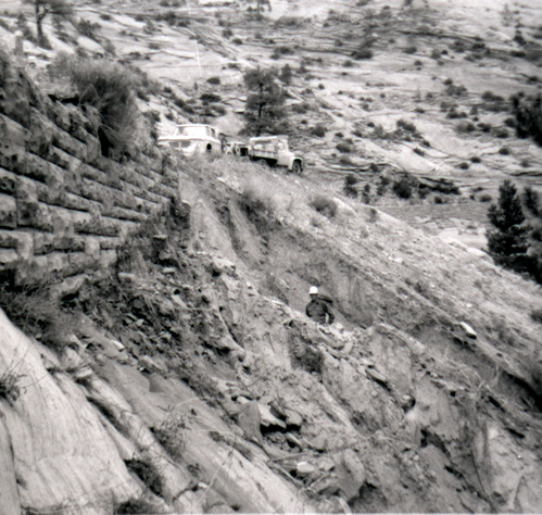 Man working on retaining wall repairs along the East Rim road.