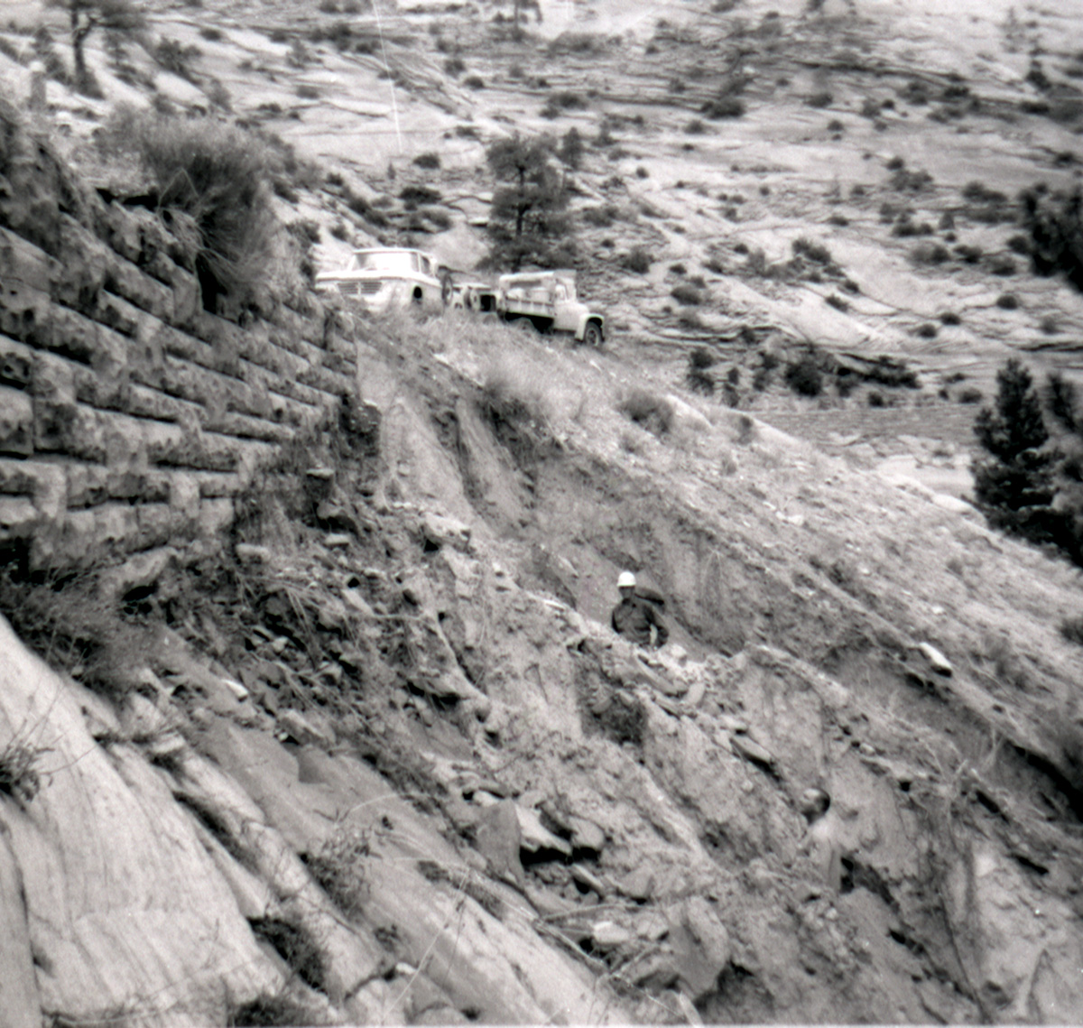 Man working on retaining wall repairs along the East Rim road.