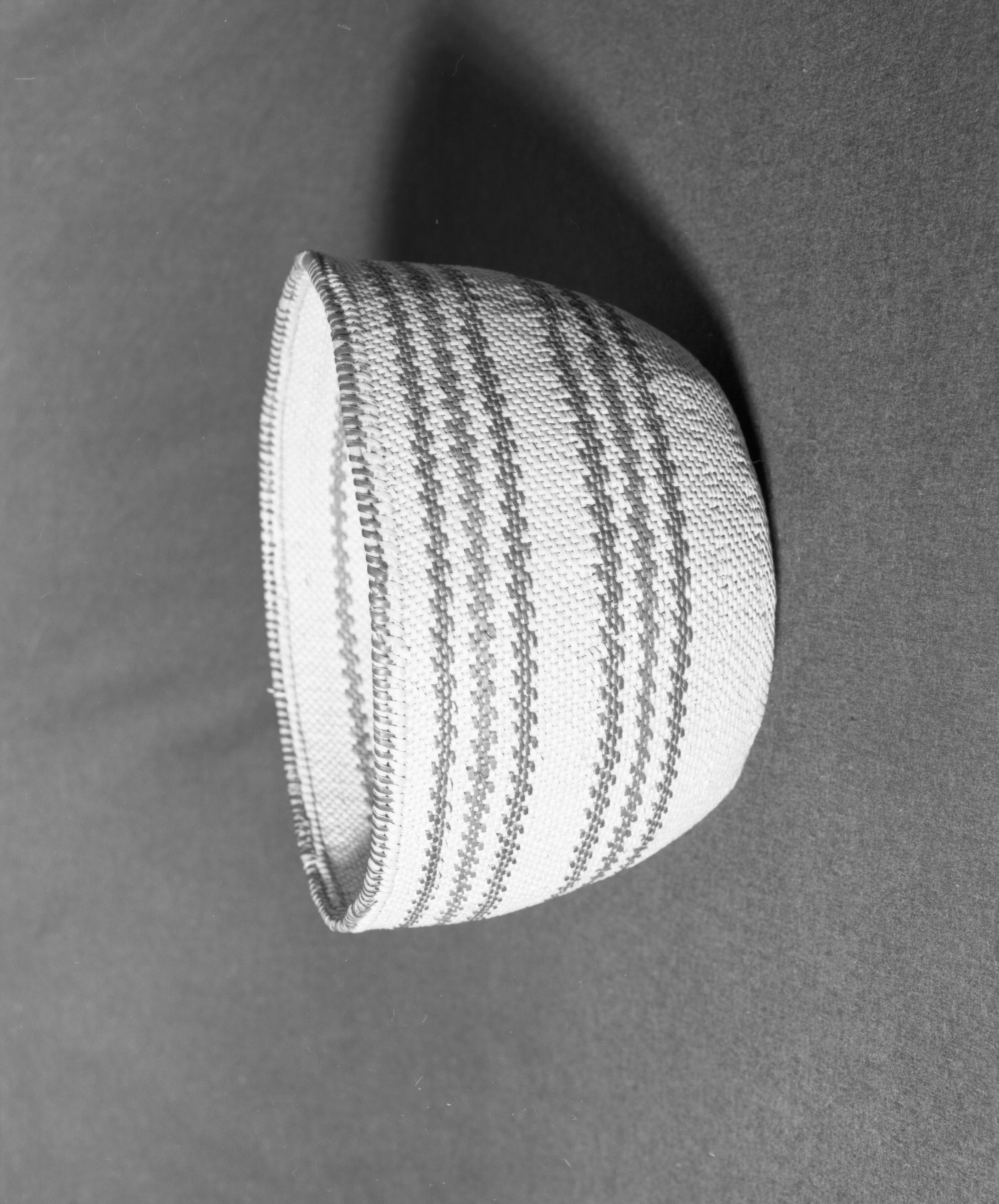 Marie Rozier Collection, Catalog No. 87. Object: Western Mono bush boiler. Dimensions: 10 x 8". Materials: split willow, split redbud, bracken fern root, sourberry sticks. Technology: diagonally twined, up to right slant of turns. Collection History: purchased from Mrs. Louise Fuentes, Central Miwok. Photographed by Michael Dixon, December 1982. Catalogued by Craig Bates and Barbara Beroza. Yosemite Collections, National Park Service.