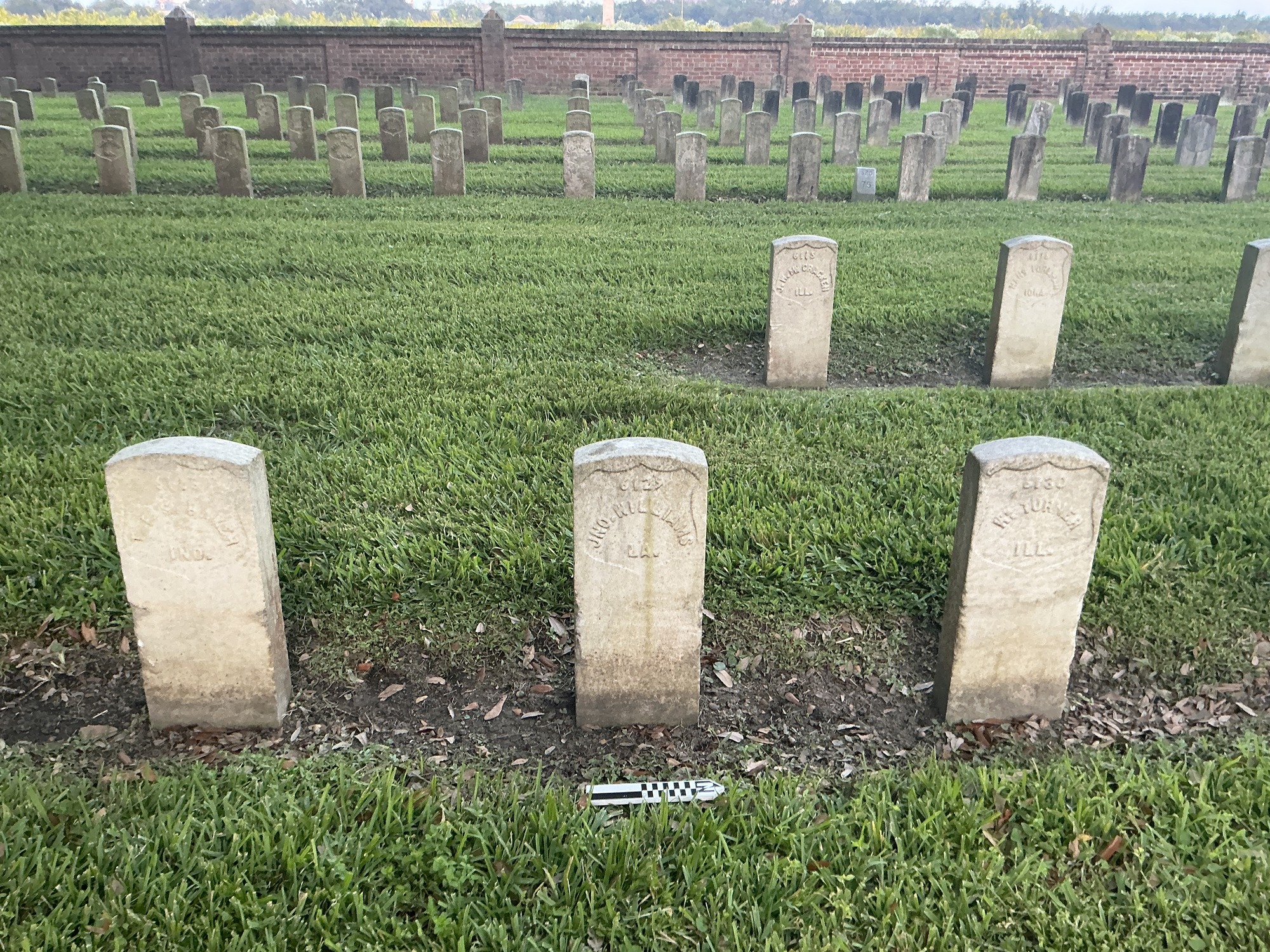 Extra image of historic upright marble headstone with recessed shield face.