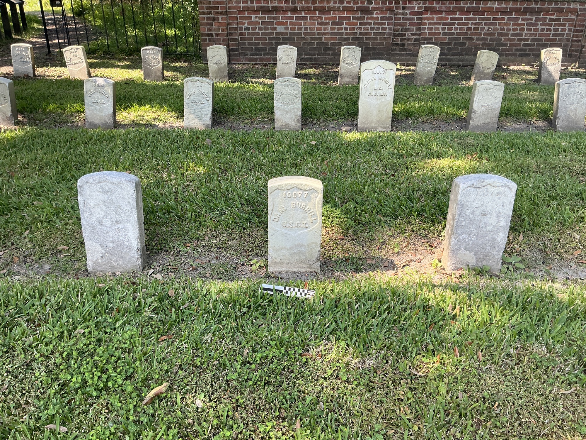 Extra image of historic upright marble headstone with recessed shield face.