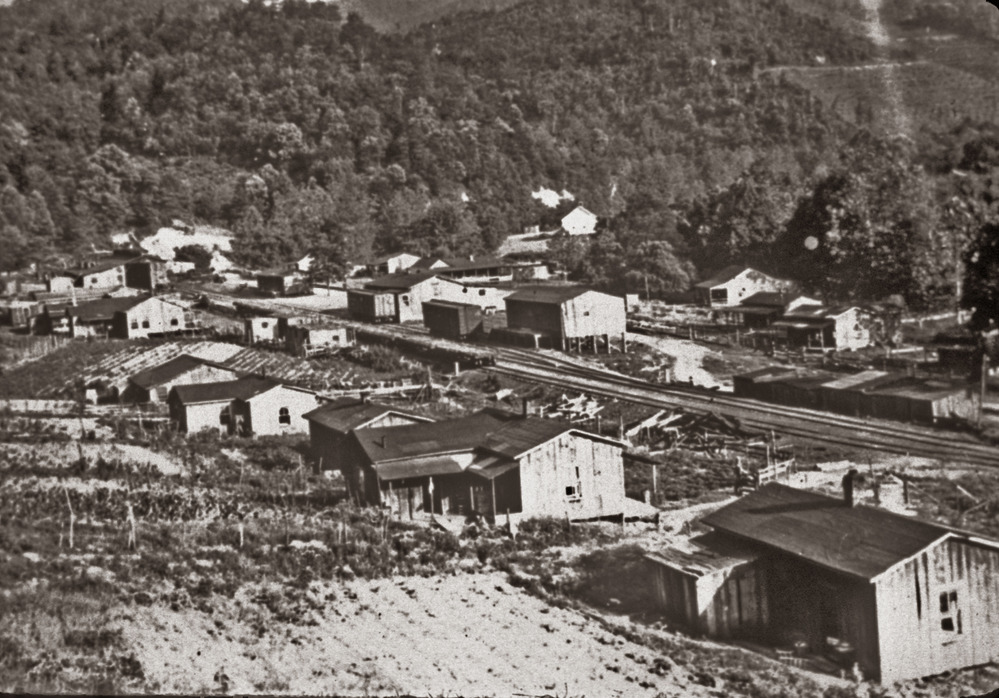 Houses of logging company employees sit adjacent to the railroad track in Elkmont.