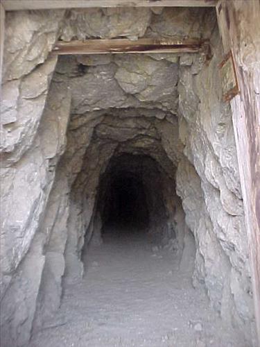 Open shafts and adits at Paymaster Mine, an abandoned gold mine in July 2004.