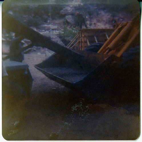 Construction vehicles working on road repairs.