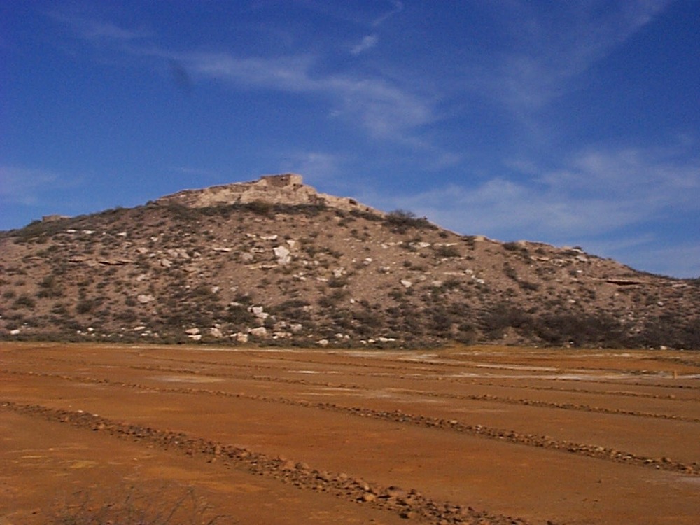This shot, from before 2006, includes the orange dirt of the tailings. This was where by-products of the copper smelting process were dumped. In 2006 the tailings were capped, to minimize runoff and pollution of the Verde River and groundwater.