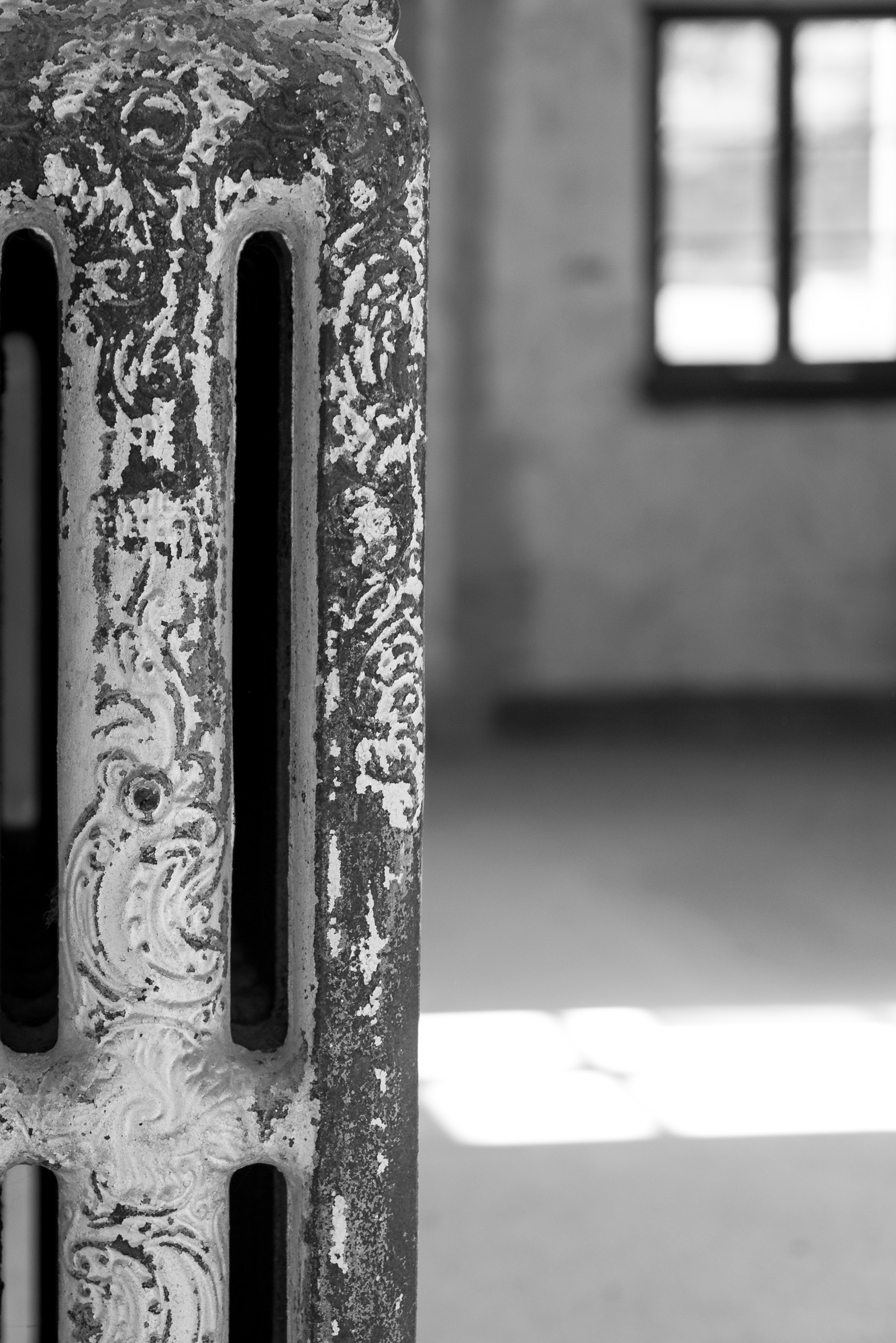 black and white photo of a close up of an old radiator 