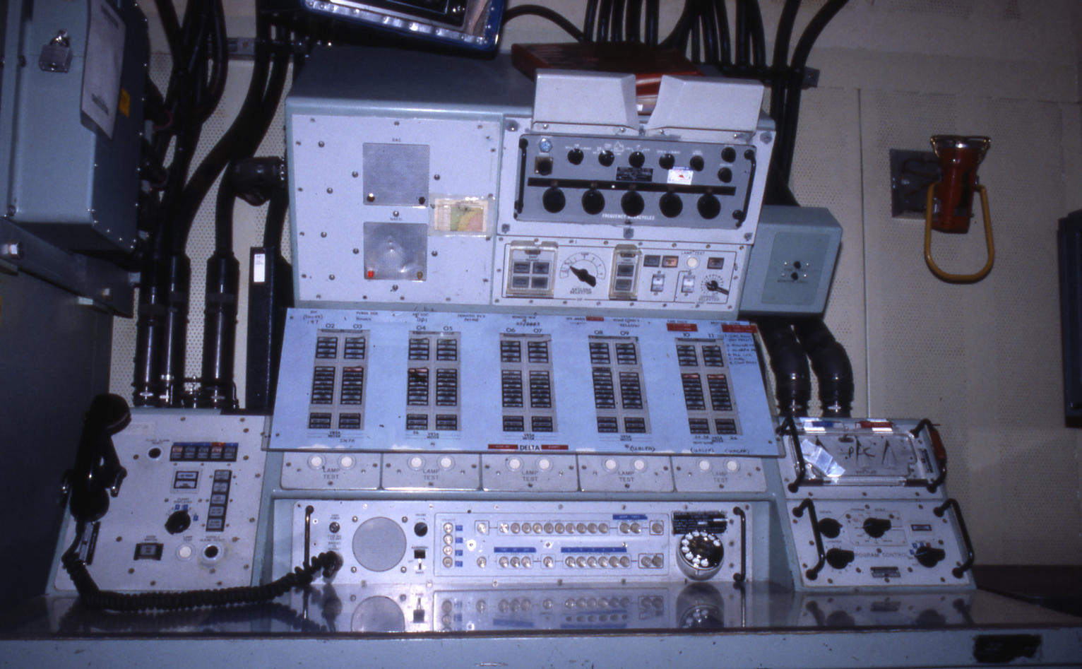 A tall console with lights and switches.