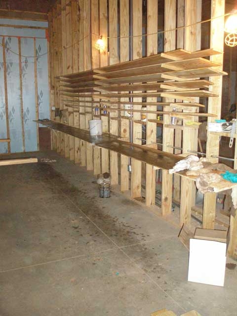 Tongue and groove slats are dried prior to installation. These will be used in the ceiling of the gallery.