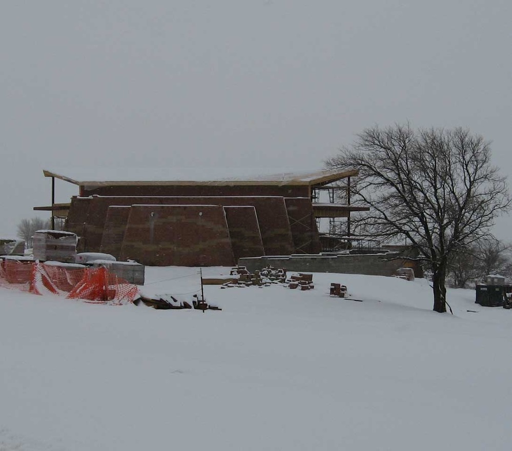 A snowfall on the winter solstice frames the new Cultural Heritage Center.