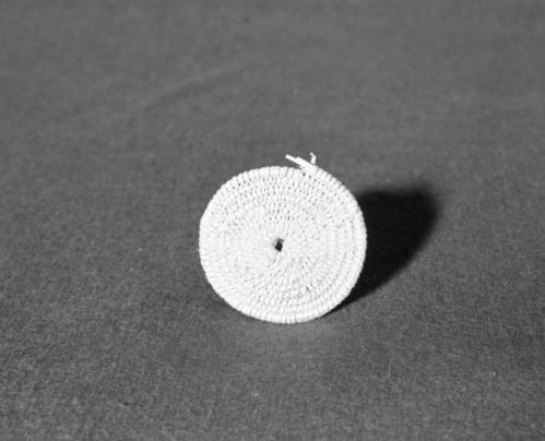 Marie Rozier Collection, Catalog No. 149. Object: Miwok coiled basket starts. Dimensions: 3" diameter. Materials: willow shoots. Technology: three rod willow with split willow shoots; interlocking stitch; fag ends flipped and caught by successive stitches; moving ends trimmed on back face; lots of split stitches on interior and exterior. Collection History: Made by Louise Fuentes at age 80. Photographed by Michael Dixon in December 1982.  Catalogued by Craig Bates and Barbara Beroza. Yosemite Collections, National Park Service.