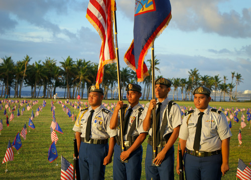 Local youth flag honor guard at Memorial Day flag event.