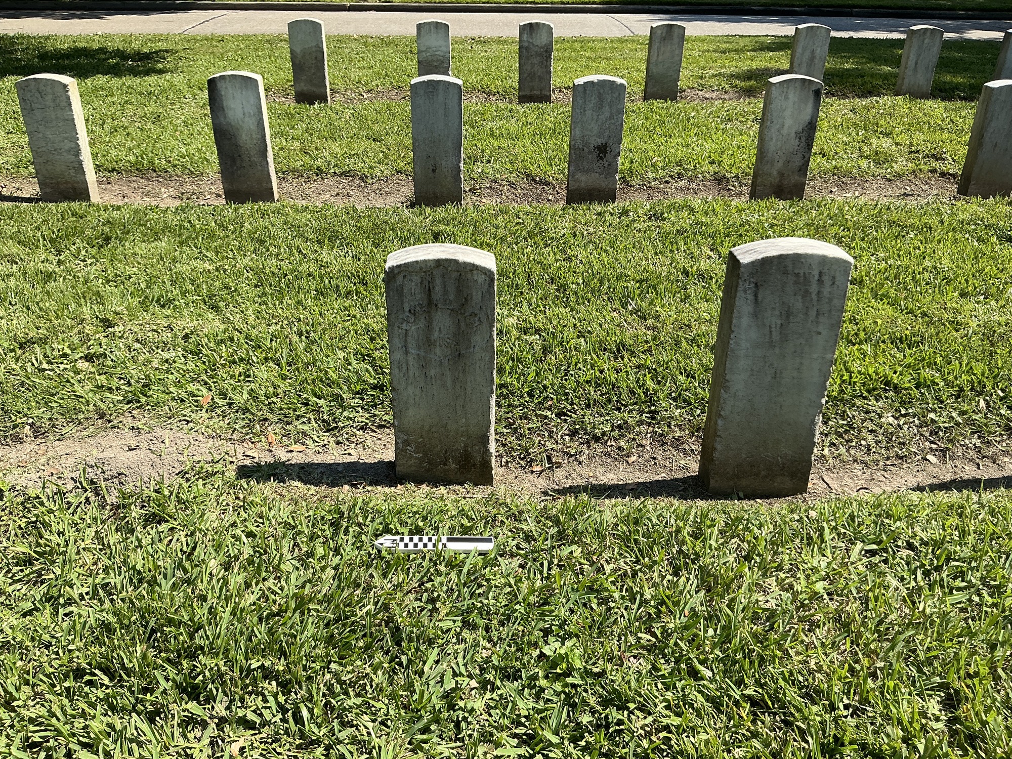 Extra image of historic upright marble headstone with recessed shield face.