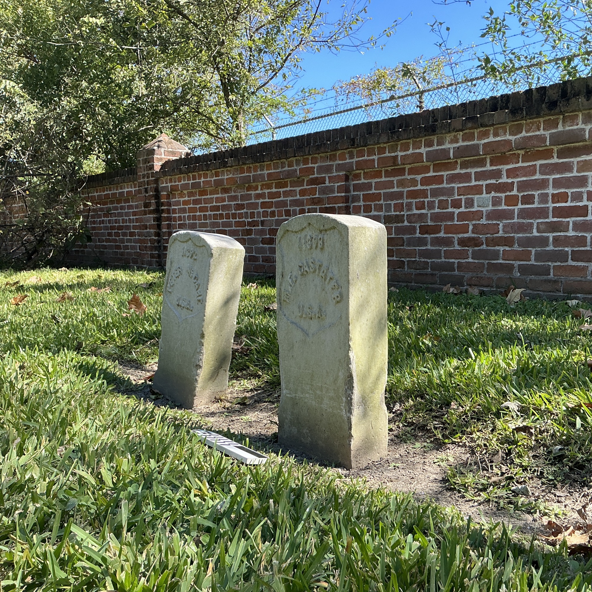 Extra image of historic upright marble headstone with recessed shield face.