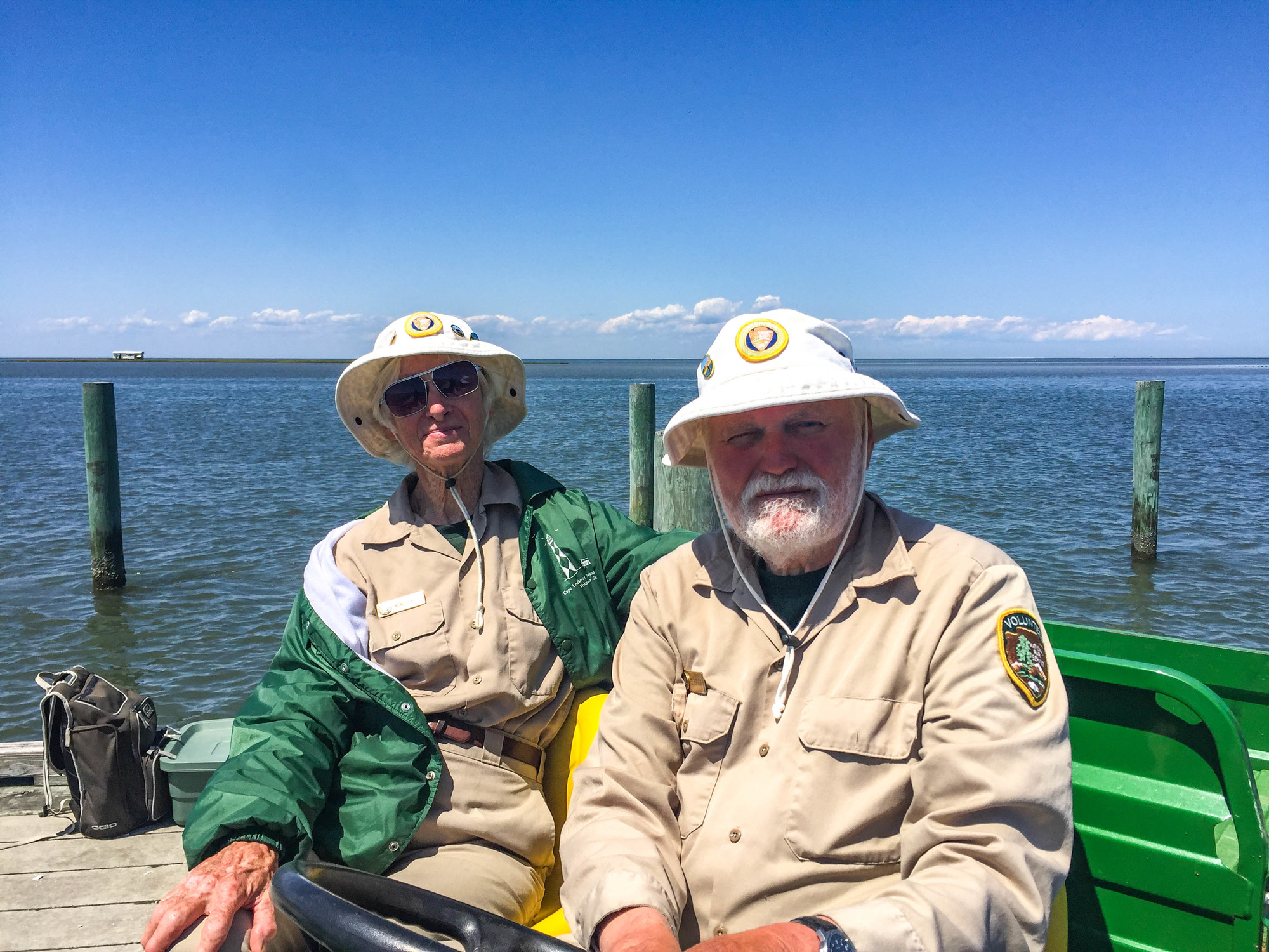 Two volunteers on a dock