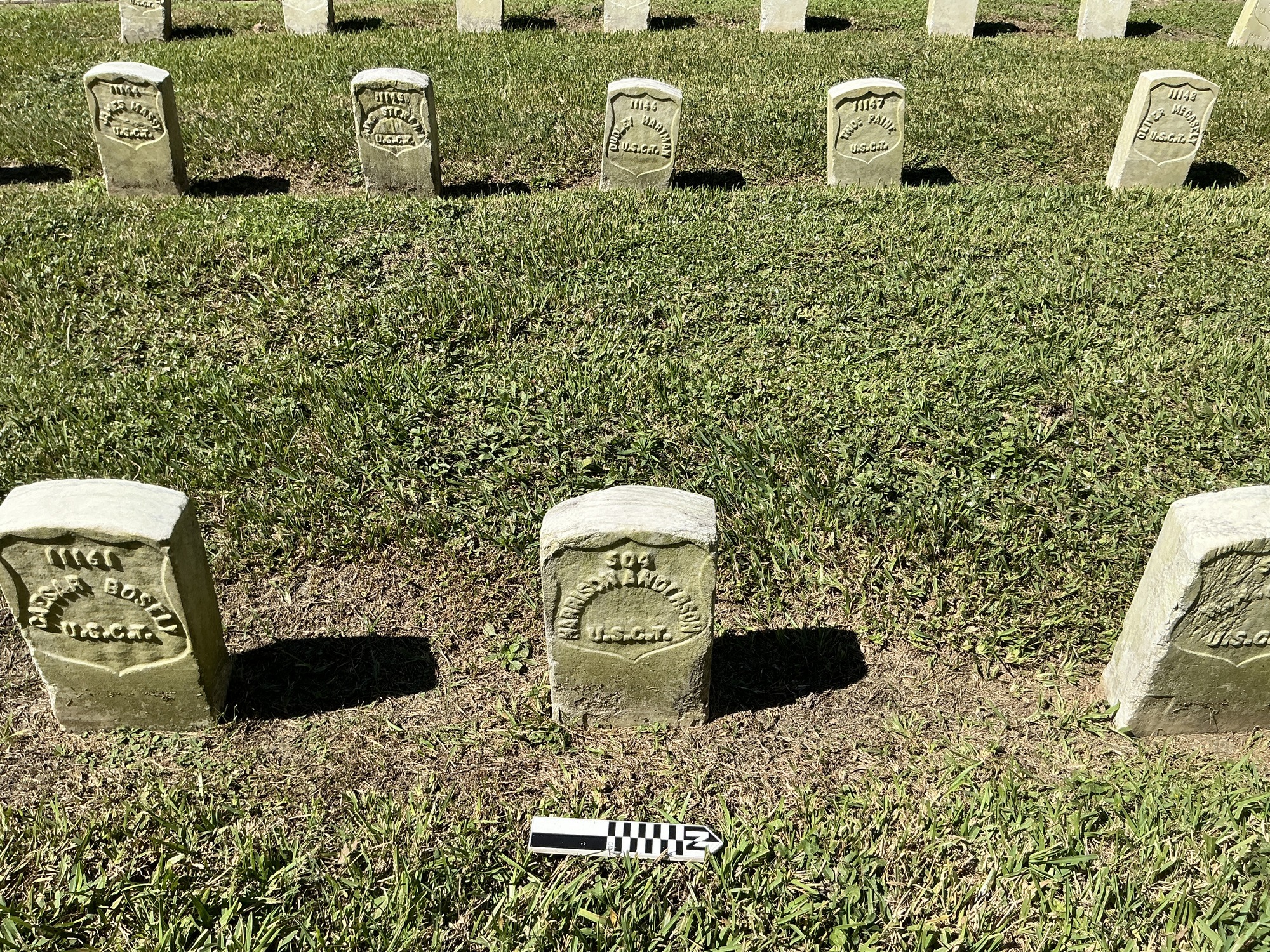Extra image of historic upright marble headstone with recessed shield face.