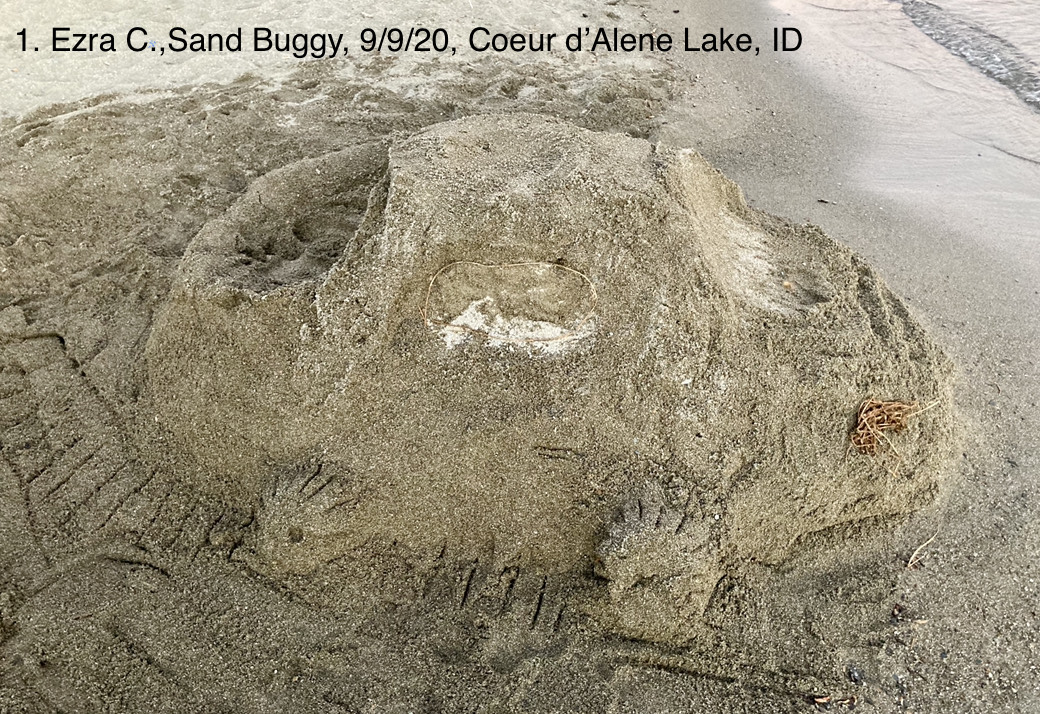 A small sand sculpture of a dune buggy.