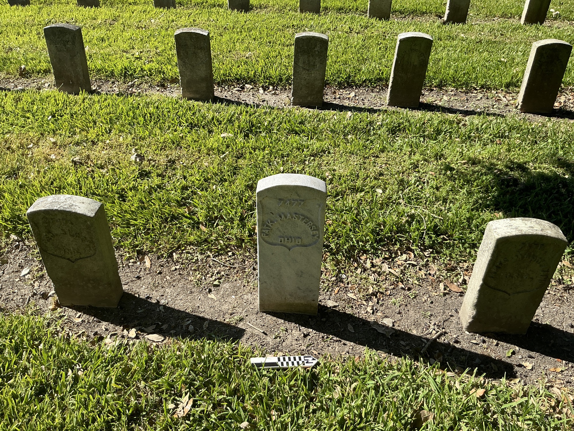 Extra image of historic upright marble headstone with recessed shield face.