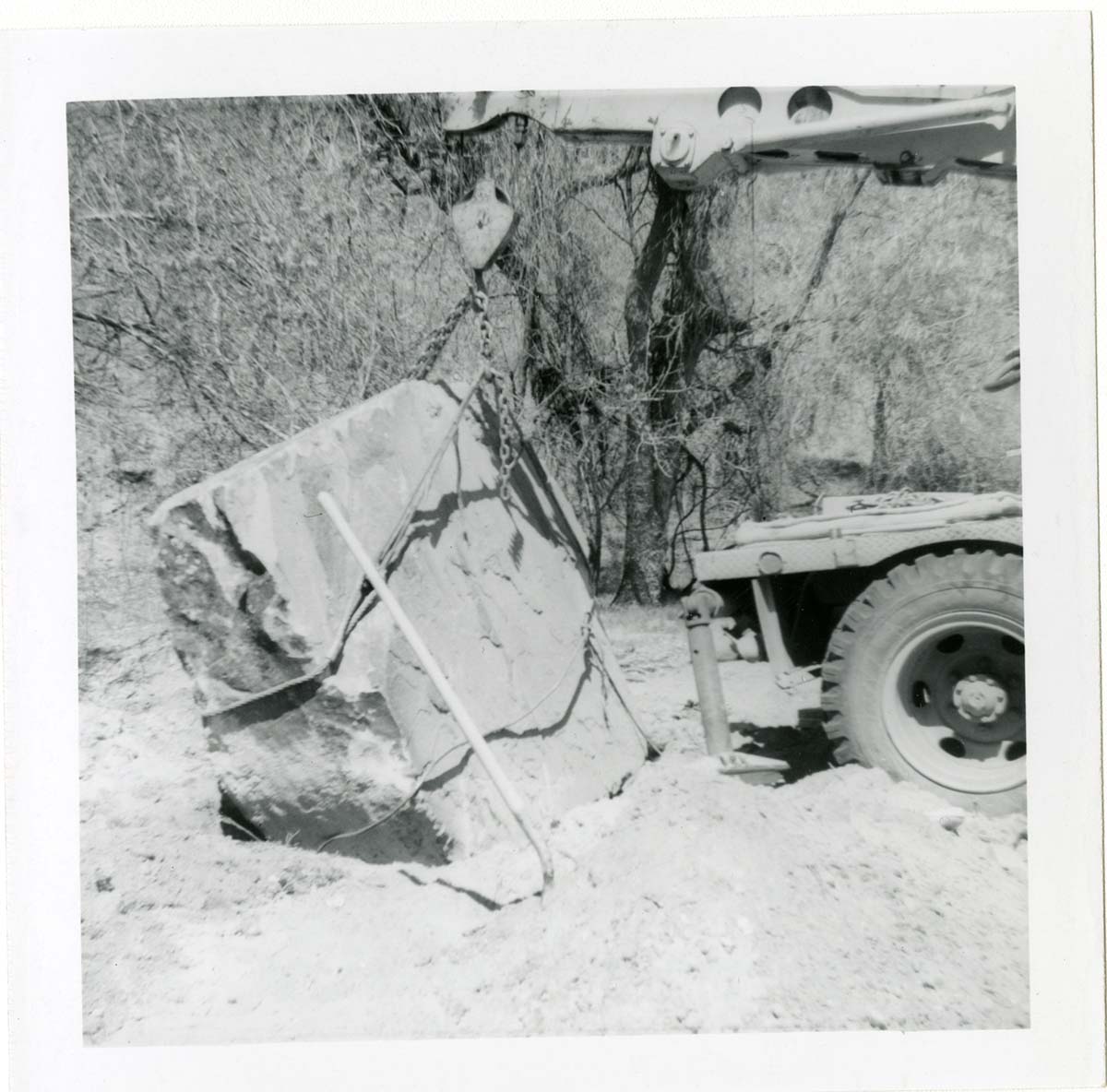 Construction vehicle placing rock during the Lady Mountain sign emplacement.