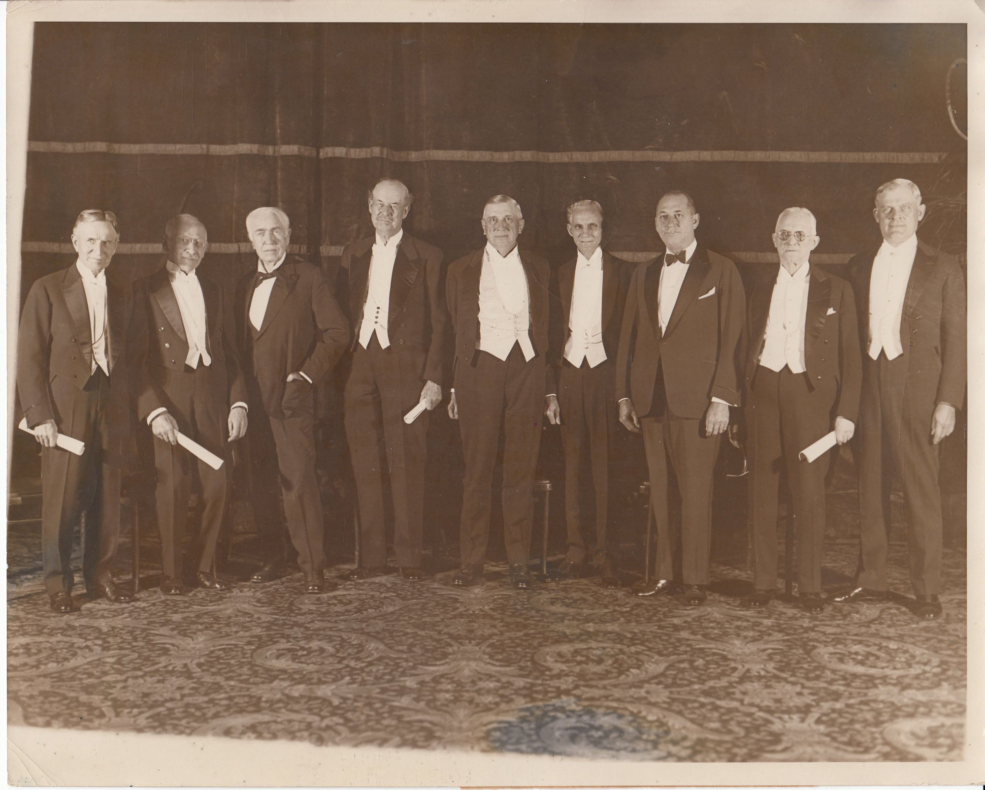 Left to right, Harvey Firestone, Julius Rosenwald, Thomas Edison, Thomas Lipton, Charles M. Schwab, Henry Ford, Walter P. Chrysler, George Eastman, and Thomas Wilson.