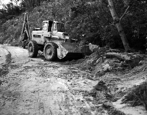 Flood damage - end loader clearing park roads of debris after heavy rains of September 17 and 18, 1961.
