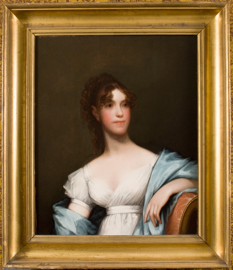 Three-quarter-length portrait of young woman in white dress and blue shawl