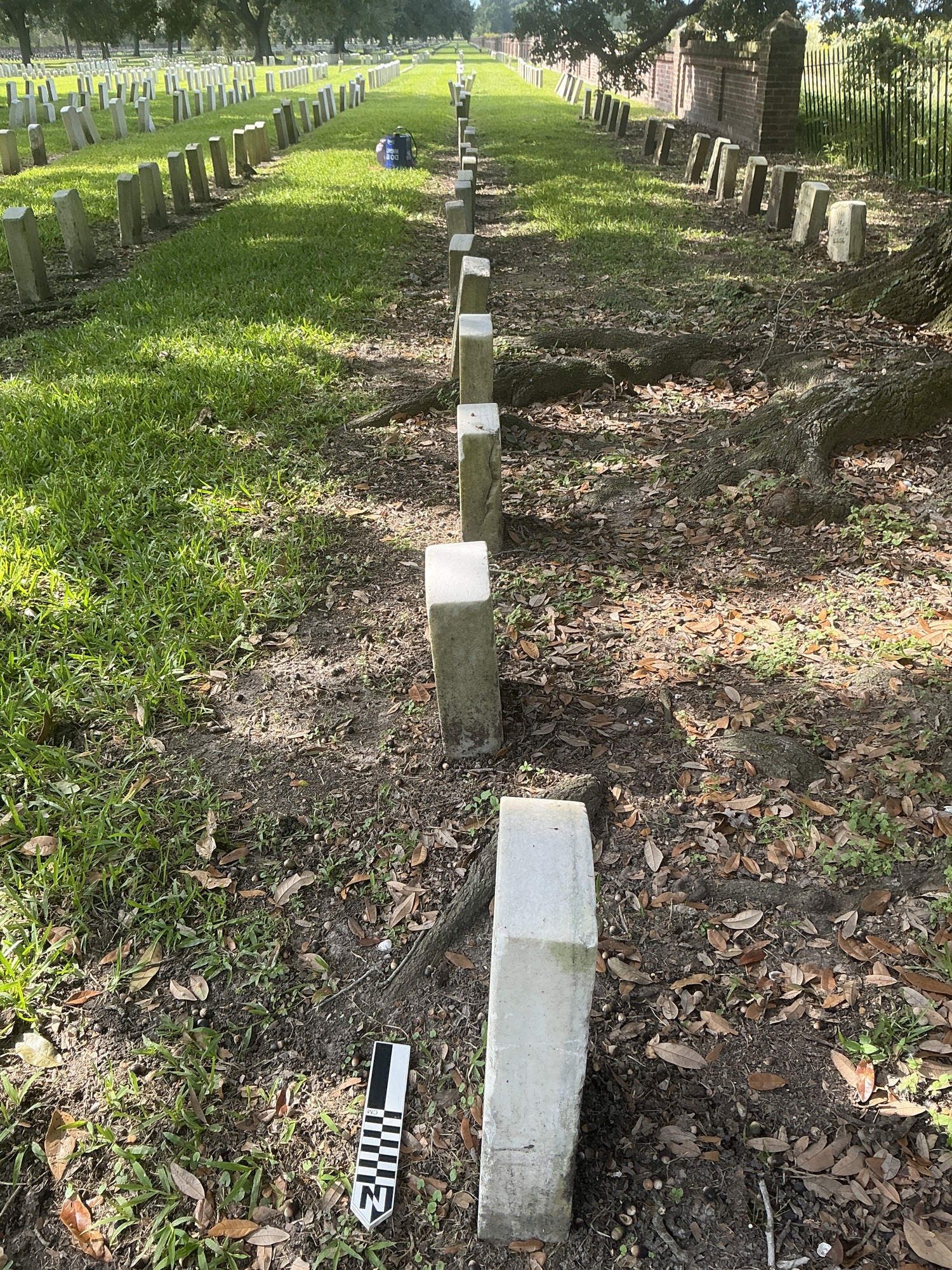 Extra image of historic upright marble headstone with recessed shield face.