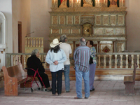 A group of people inside a religious place.