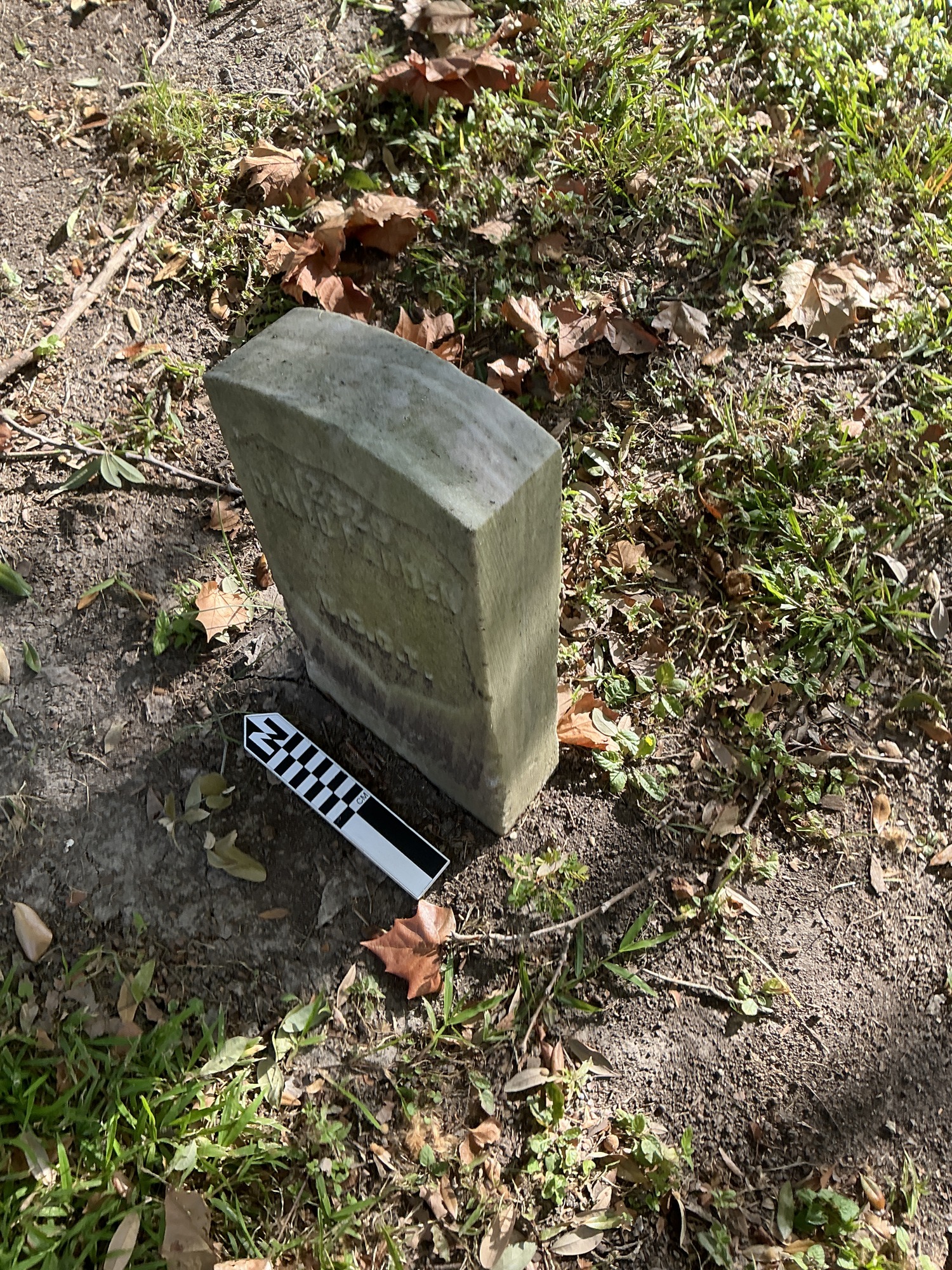 Extra image of historic upright marble headstone with recessed shield face.