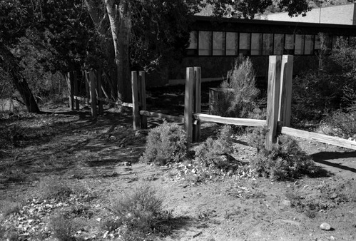 Wooden fence being built during the construction of headquarters addition.