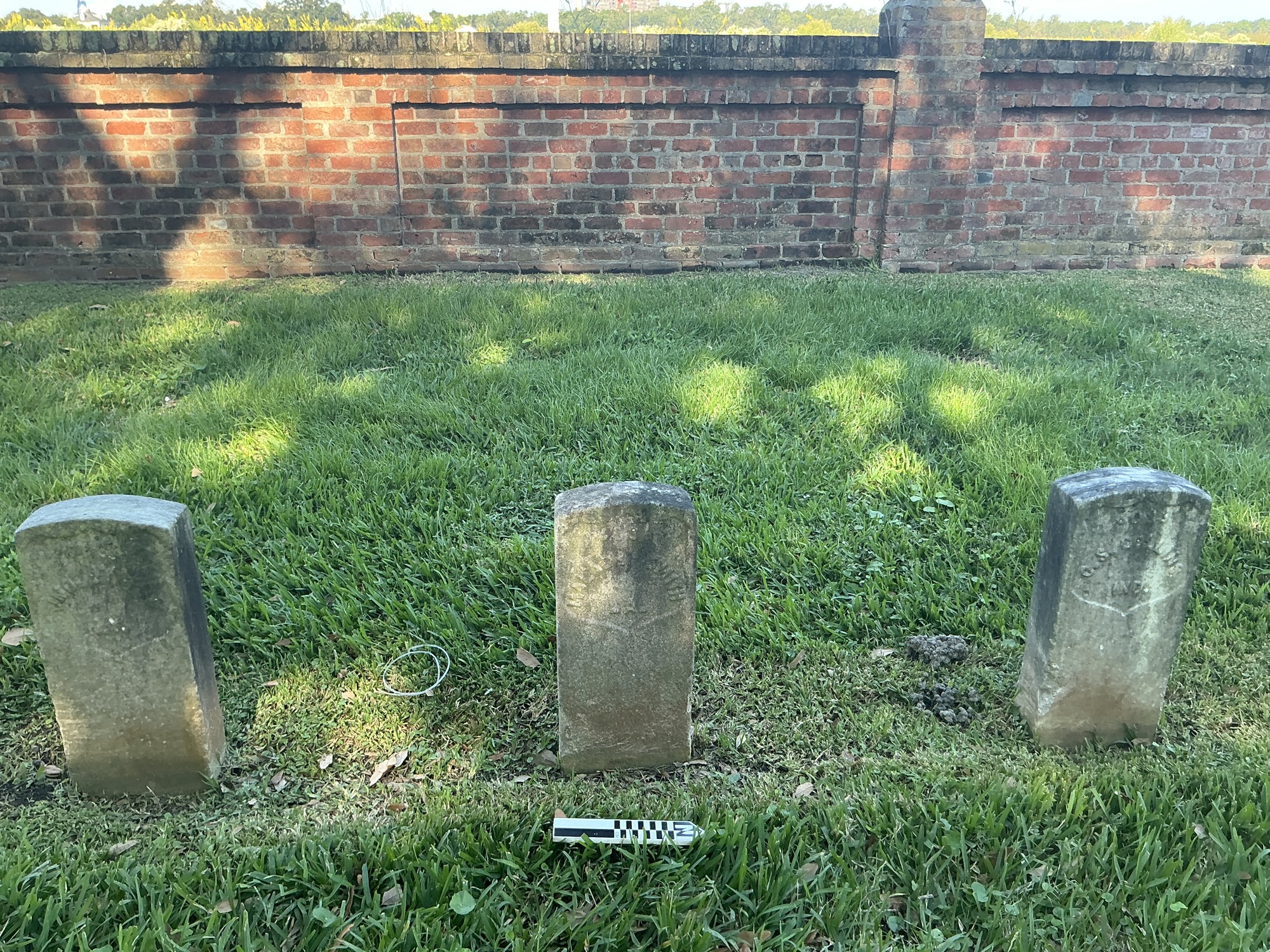 Extra image of historic upright marble headstone with recessed shield face.