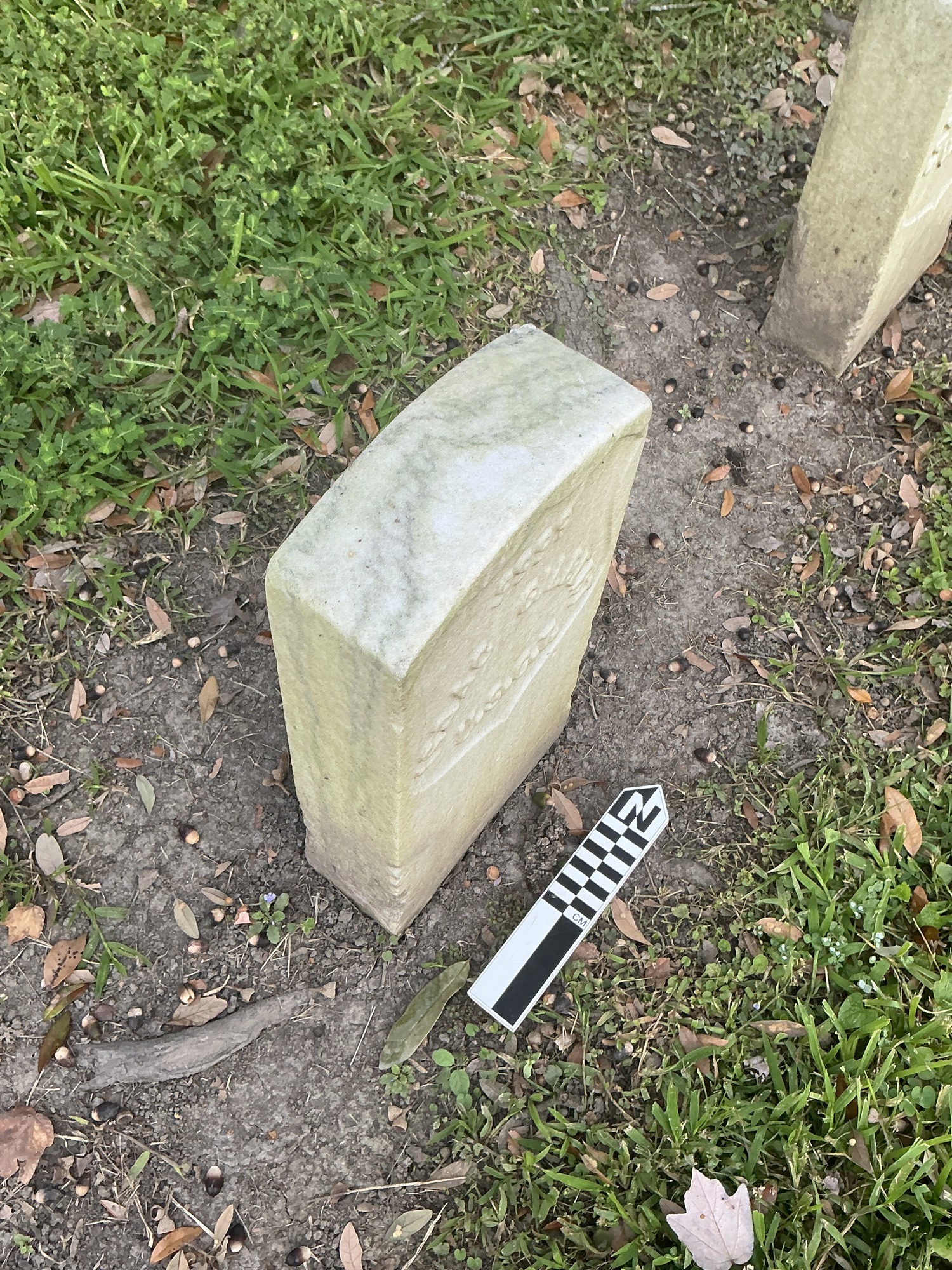 Extra image of historic upright marble headstone with recessed shield face.