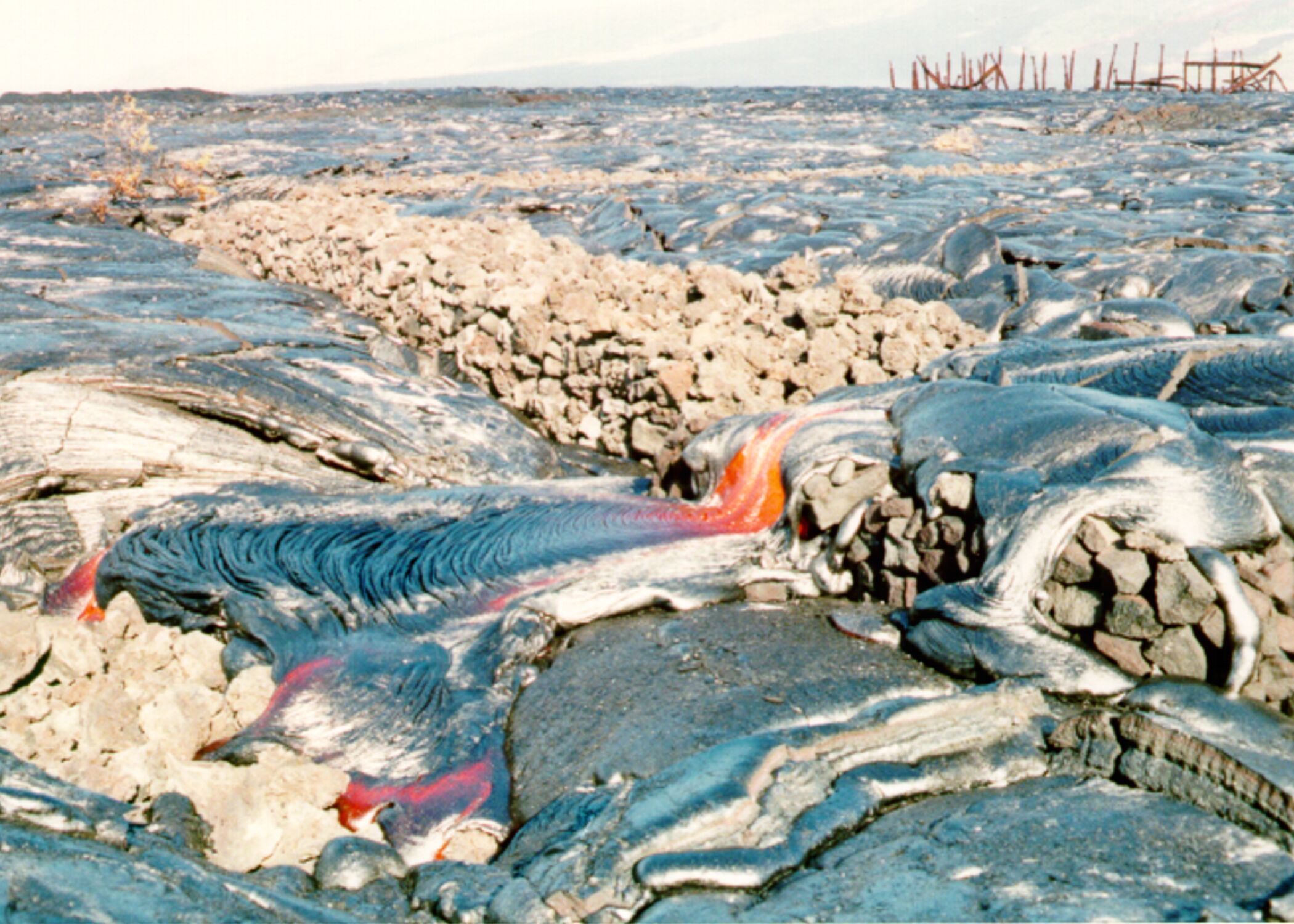 Lava flows over a stone wall