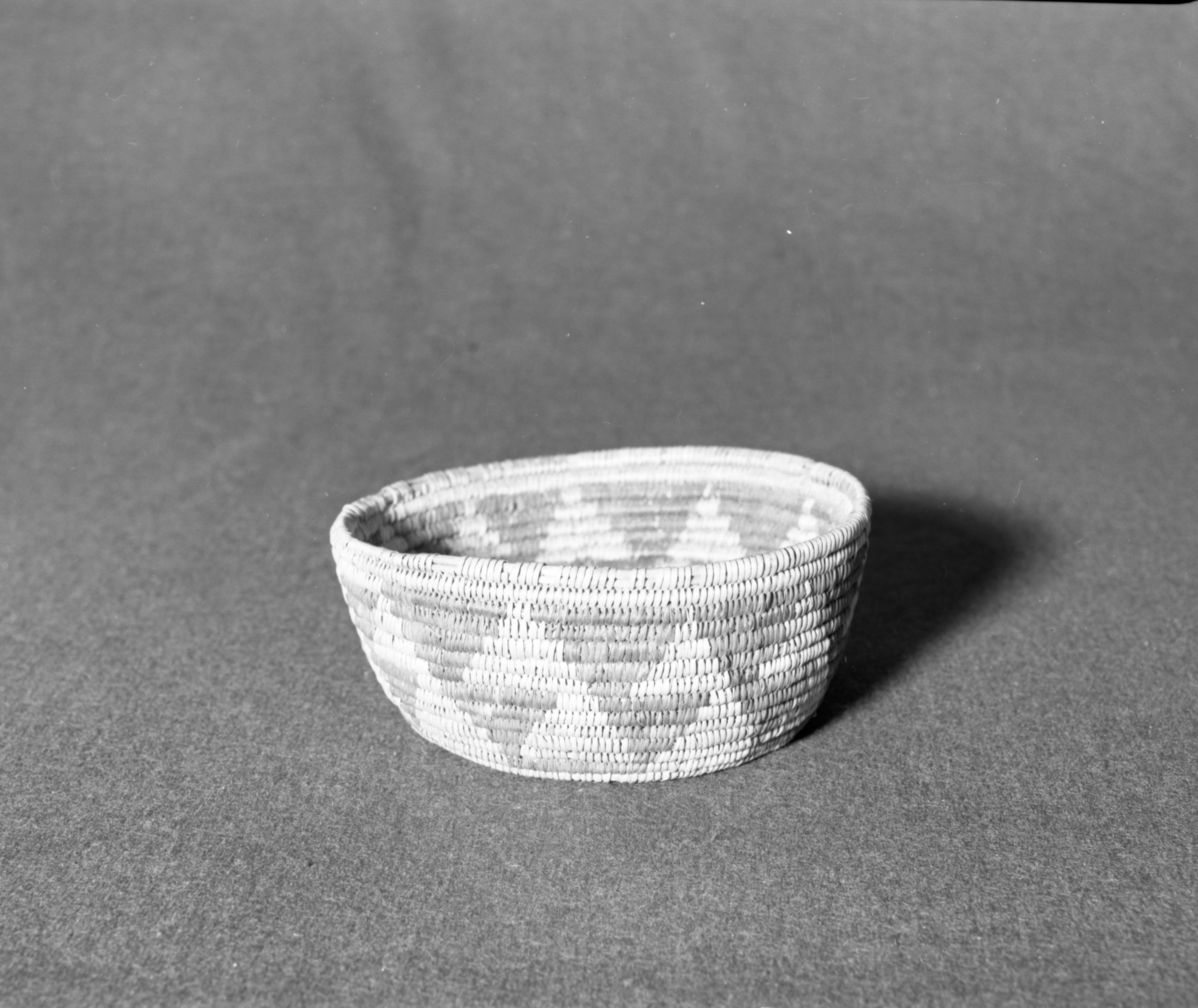 Marie Rozier Collection, Catalog No. 169. Object: Unknown origin. Dimensions: 7 x 3". Materials: Split willow shoots, split devil's cloth. Technology: Tree rod willow, interlocking stitch, fag ends concealed in foundation, moving ends trimmed on back face, leftward coil direction. Collection History: Acquired from Ora Doyle. Photographed by Michael Dixon in December 1982. Catalogued by Craig Bates and Barbara Beroza. Yosemite Collections, National Park Service.