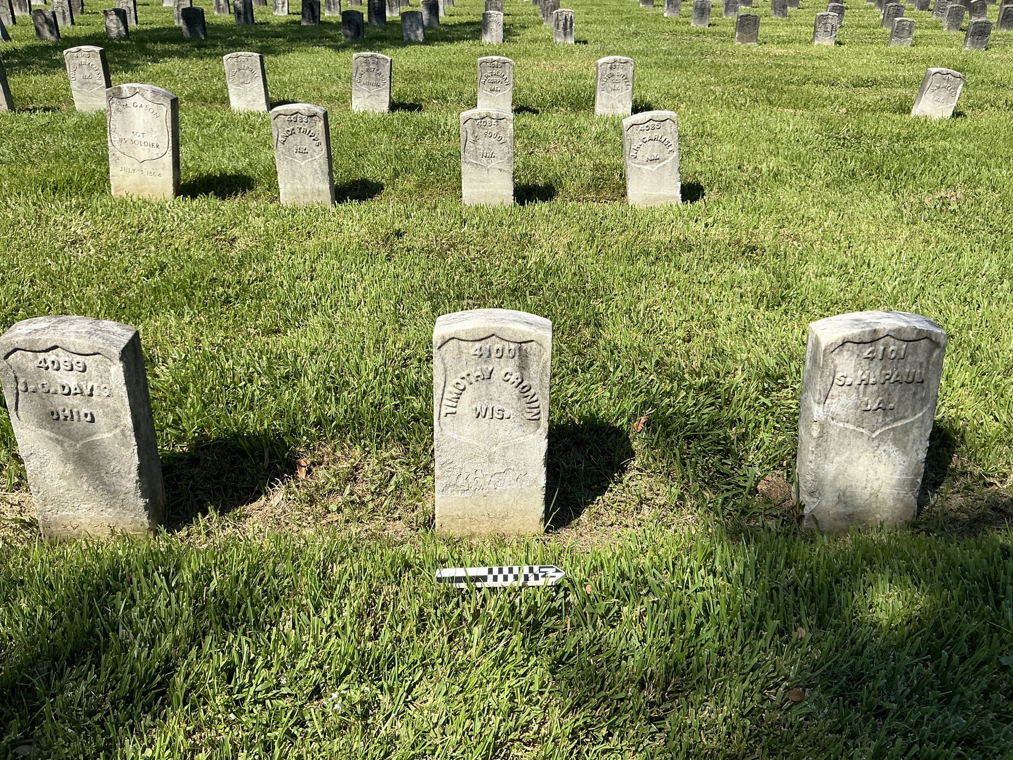 Extra image of historic upright marble headstone with recessed shield face.