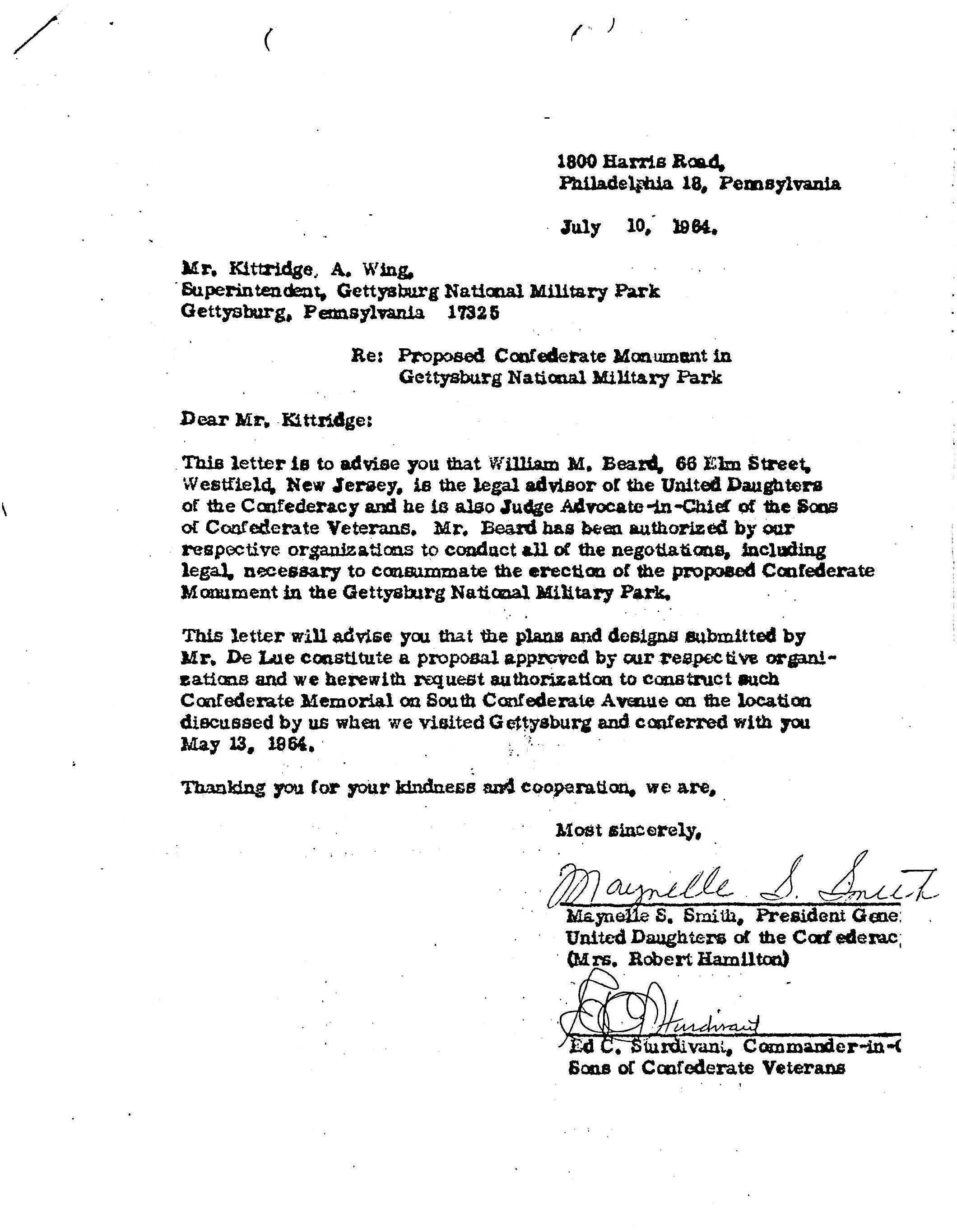 White paper with typed black text and a handwritten signature