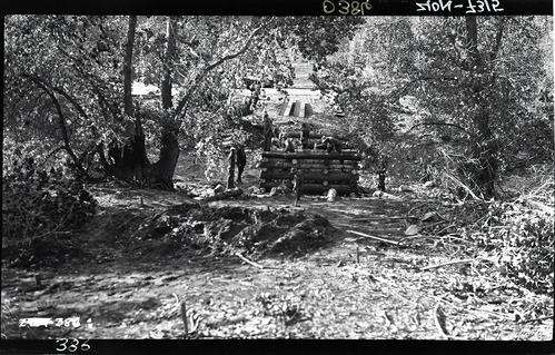 Bridge Across Virgin River with several Civilian Conservation Corps (CCC) workers constructing log structure.