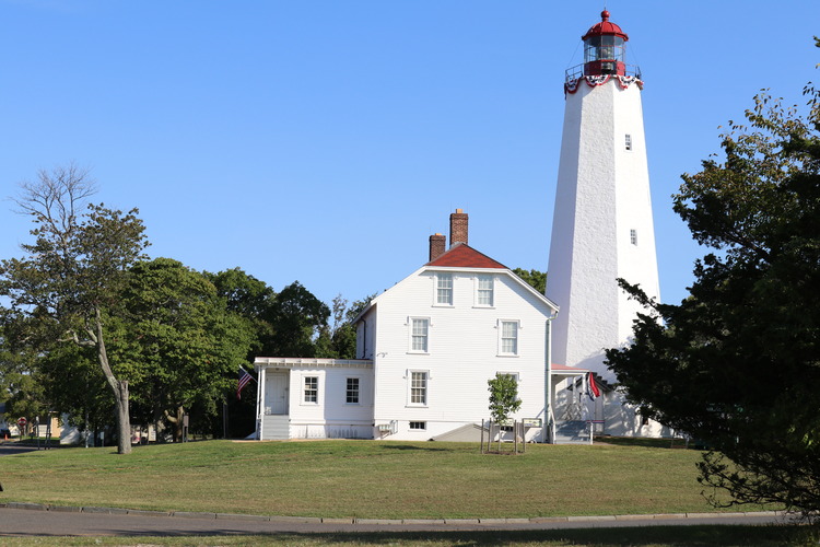 white lighthouse and buildign
