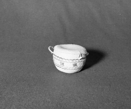 Marie Rozier Collection, Catalog No. 2A-7. Object: Maori (?) basket. Dimensions: 3 1/2". Materials: coconut shell, fiber, commerical dyes, shells. Collection History: Purchased 1970 in Rorotua, New Zealand. Photographed by Michael Dixon, December 1982. Catalogued by Craig Bates and Barbara Beroza. Yosemite Collections, National Park Service.