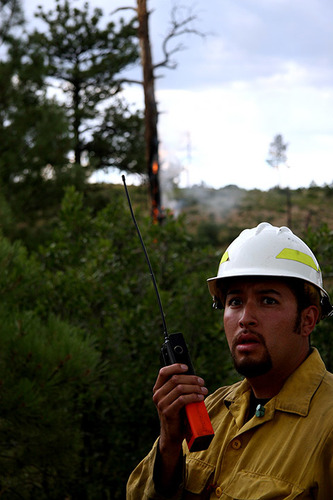 firefighter at Fire camp wearing a hard hat 