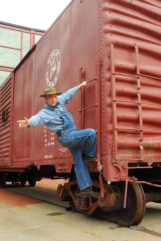 Ranger in mechanic's clothing aside boxcar