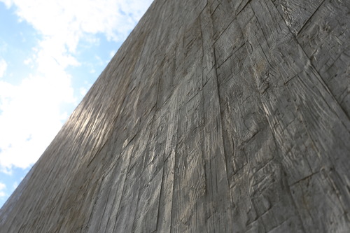 Gray walls with blue sky and clouds