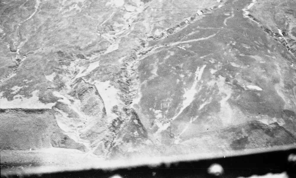 Rocky, snowy landscape from the air