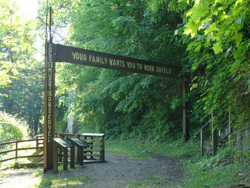 safety sign over an old road