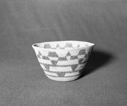 Marie Rozier Collection, Catalog No. 42. Object: Miwok cooking basket. Dimensions: 10 1/4 x 6". Materials: bullpine, redbud. Technology: single rod, leftward coil direction, fag ends trimmed on workface, moving ends trimmed on backface, overstitched clockspring start, unusual banded pattern. Collection History: Acquired from Mrs. Hallen, probably collected before 1930. Photographed by Michael Dixon, December 1982. Catalogued by Craig Bates and Barbara Beroza. Yosemite Collections, National Park Service.