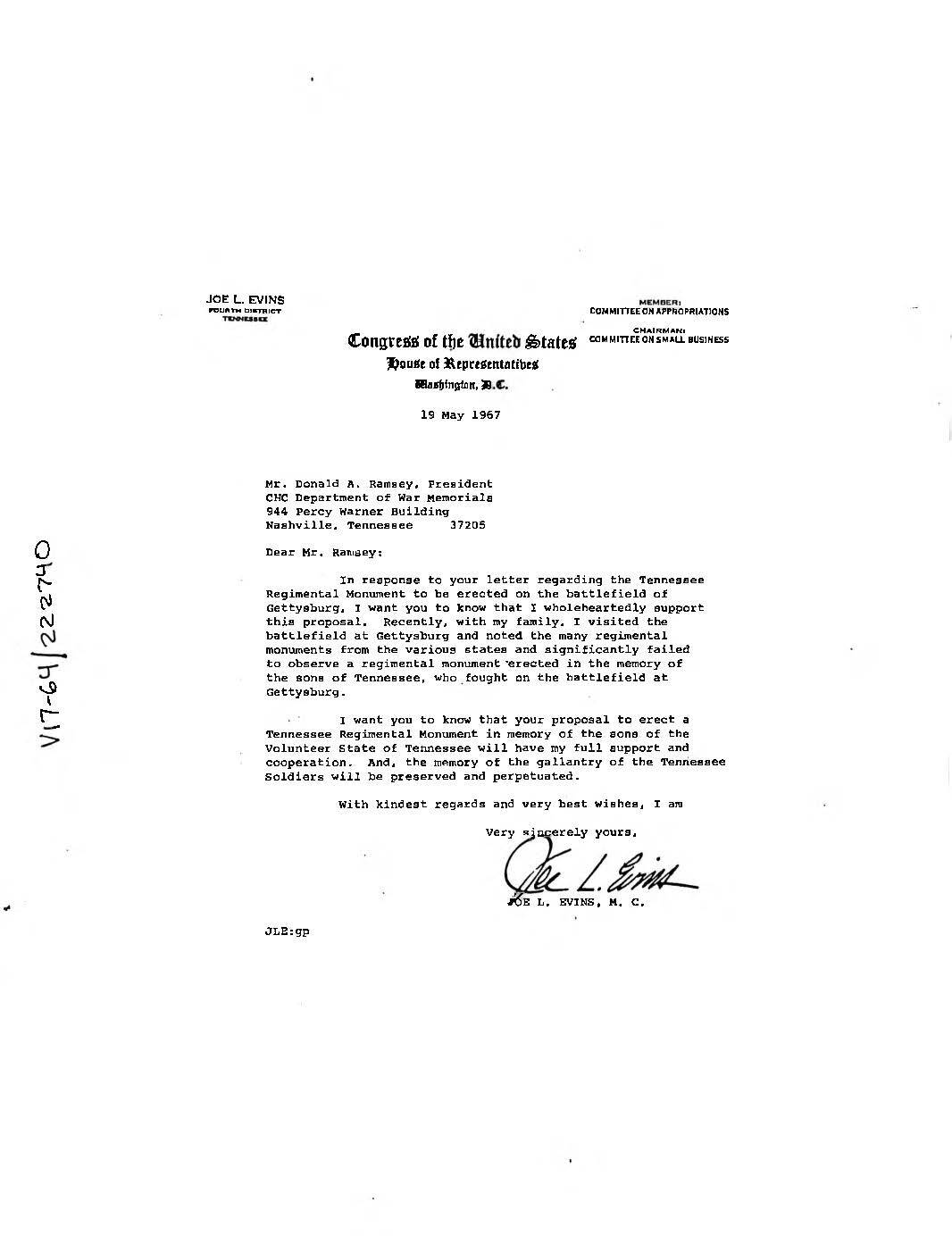 White paper with typed black text and a handwritten signature