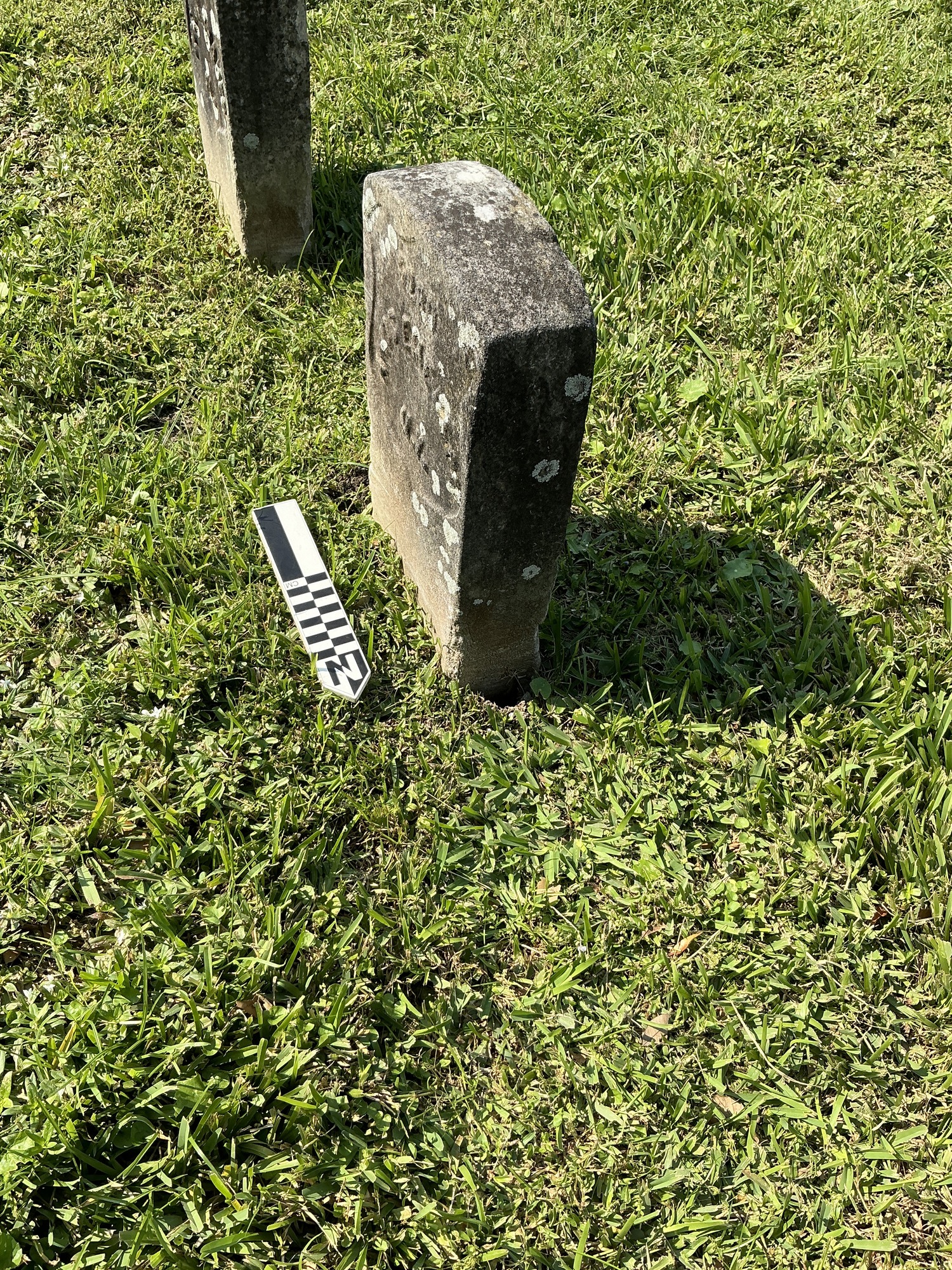 Extra image of historic upright marble headstone with recessed shield face.
