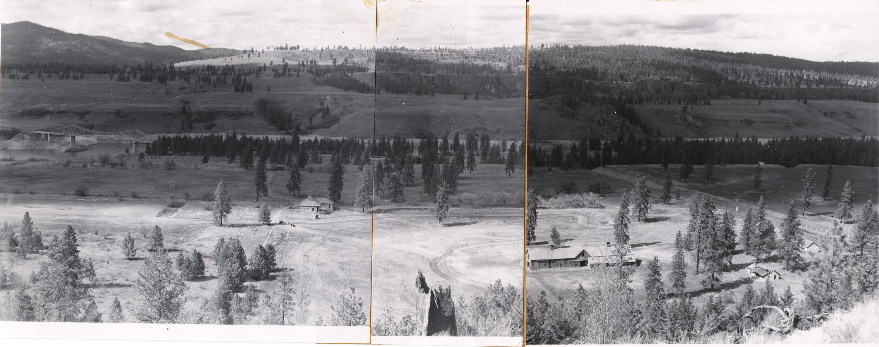 Black and white photo of a valley composed of three images stitched together.