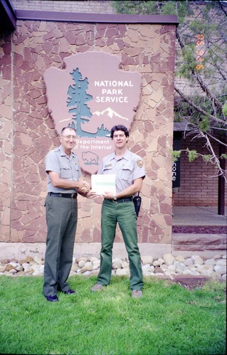 Color Photos of Superintendent Harold Grafe giving out awards to park personnel.
