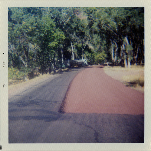 Sealcoat work on road.