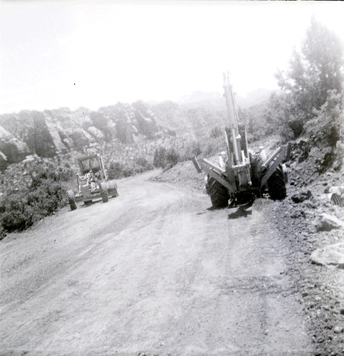 Tractors working on constructing the road along the scenic canyon drive near the Grotto.